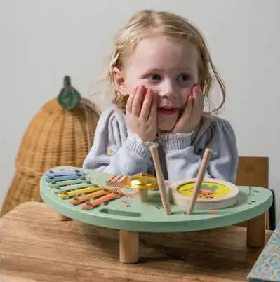 Little girl happy with this music station