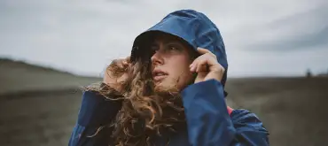 Enjoying-cold-autumn-day-with-hood-her-head